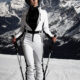 Model Kirsten wears latex underneath her ski outfit (AI generated background)